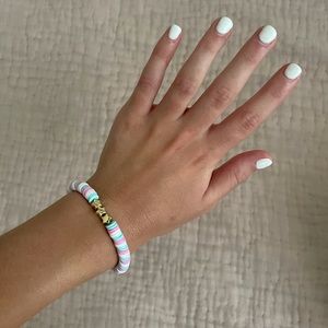 light pink, blue & white bracelet w 3 gold stars